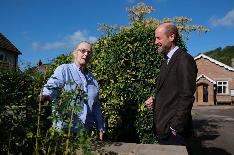The Prince of Wales meets local resident Jacqueline Brown, during a visit to the village of Skenfrith (Mathieu Willcocks/PA Wire)