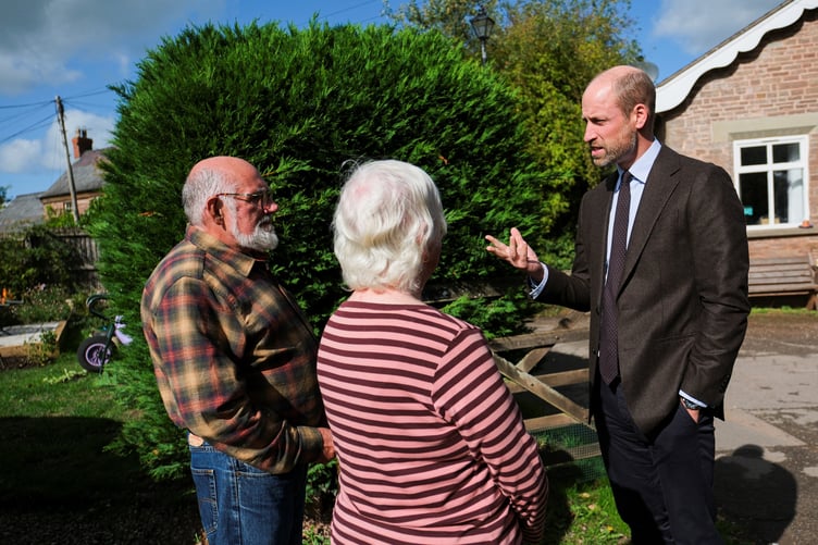 The Prince of Wales meets local residents, Andrew Hooper and Ginette Lee (Mathieu Willcocks/PA Wire)