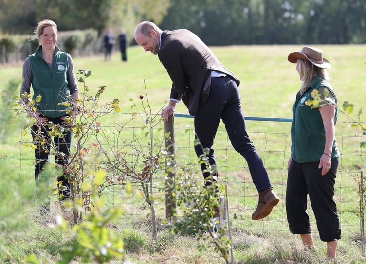 The Prince of Wales climbs over a wire fence during a visit to White Castle Farm in Abergavenny, to meet representatives from Stump Up For Trees, a community-based environmental charity working across South Wales to restore native woodland and recognise its powerful potential to support sustainable solutions to flooding risk. ( Photo by Chris Jackson/PA Wire)
