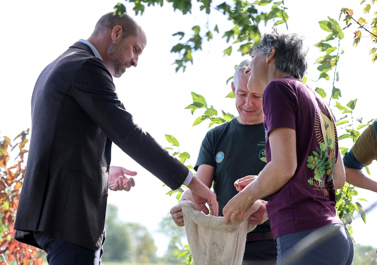 The Prince of Wales joins volunteers participating in a seed collection activity during a visit to White Castle Farm (Chris Jackson/PA Wire)
