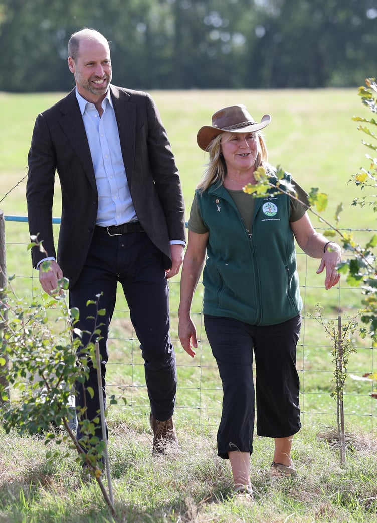 The Prince of Wales laughs with Kate Beavan from Great Tre-rhew Farm during a visit to White Castle Farm